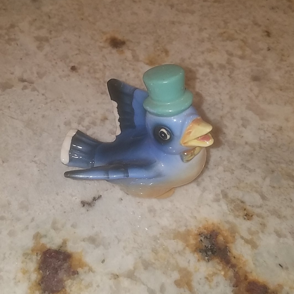 Porcelain blue bird with green top hat